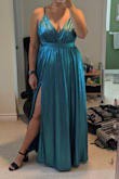 I truly feel like an ice princess in this dress. The only caveat is that it runs quite large. Based on my measurements I was likely to fit in an XL over a L but the comments made me go with the L. The dress was still huge and I needed it taken in and hemmed. It is also a bit on the heavier side. Otherwise, it's beautiful! Pics are after I got it taken in and hemmed. - Dayna W.