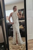 Ordered a small based on the little size survey offered by Lulu's. Based on the dimensions it fits nicely just too long. Not sure if that's intentional so it fits lots of different heights but even with heels on its still too long. I can get it hemmed but just be warned if you order give yourself enough time before important dates to get alterations. It also shipped very fast and came before expected delivery date which was nice. Altogether it was a good experience and I'm happy with the purchase! - Adriene O.