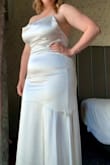 I wore this for my elopement and it was perfect for the occasion. For the most part, the dress fit perfectly, so even though it was a little small at the time, I wouldn't have sized up, I just wish I'd gotten better shapewear. Excited to wear the dress again for other events! - Andrea C.