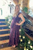 This dress was so stunning and very flattering! Quality is excellent. I typically wear a large, I'm wide in the hips and thighs, but smaller in the waist decided to size down due to reviews and it fit absolutely perfect! I did alter the v-neck just slightly for personal preference as it is very deep. - Devry R.