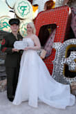 My husband and I renewed our vows at the Neon Museum in LV, NV and this dress could not have been more perfect! It fit like a glove without any need for additional tailoring (I'm wearing 6" platform heels). The length of the train was very long and romantic, and it looked very expensive. The lace and tulle were thick to the touch but delicate in appearance at the same time. Plus, the dress was very easy to iron after several long flights compressed in a suitcase. Highly, highly recommend it!!! - Caitlin M.