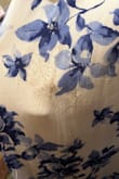 Very lightweight and easily wrinkled material. Followed the instructions to iron it before a wedding and the dress got burned. Maybe it's my mistake but the iron heat was not high at all. Regardless I'm frustrated because I can't return it or wear it. - Abby H.