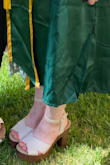Love this platform heel. Wore them for my graduation! I have wide feet and these allowed me to wear open toe heels without being self conscious about the sides of my feet hanging over the edge. Added a nice pop of brown to my green dress too. - Emily G.