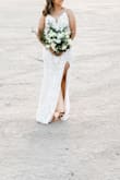 This dress was perfect for a bridal photo shoot. I was so impressed with the quality of the materials and the design. The dress was very long but I am very short. In addition, I had to wear fashion tape to keep the bust in place. Other than that I would recommend this dress for shorter events as it was also a little itchy. - Paola V.