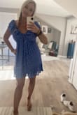 I love this dress. I get so many compliments when I wear it. I ordered it in medium originally but it shrunk a little bit in the wash so I purchased it again in large. The medium was a little too small in the chest area, the large is a little loose but it still fits great and is very flattering. - Samantha B.