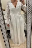 I am tall, small chested with wider hips. This fits perfectly and doesn't need any alterations. I am so excited to wear this on my wedding day! - April C.