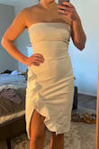 This dress is very pretty and fits well! Definitely snug but very stretchy and double lined. I would want to wear a strapless bra or nip covers with it though because there is no extra padding or anything up top. Stayed in place pretty well, but due to being stretchy and strapless I know I would be adjusting it often. Ultimately, I ended up returning because it felt too formal for my summer bridal shower. - Mackenzie D.