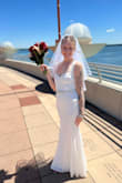 This dress was everything I hoped for. I ordered a belt to go with it to hide the seam and I couldn't be happier! I ordered an XS to make it a little more form-fitting and I got so many compliments. I seriously felt so beautiful on my wedding day. The dress came with a dress bag, and came exactly as expected! I will definitely order from Lulus again! - Britney B.
