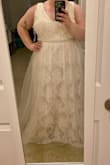 I ordered this just to have as a comparison before going bridal shopping at some of the larger bridal studios in LA, and even trying on $2,000 dresses, I couldn't stop thinking about this one?
Note, it does have a tan/nude underskirt, but the tule and the lace are bright white. This gives the overall look of the dress a creamier look. The zipper gets a little stuck around the beaded detailing, but it's worked every time. Easy to get into and out of.
I did have to get it altered- I'm kinda short, so it needed a hem, and I brought the shoulders up a bit.
Guys, I suggest wearing a bra with it- you can wear one with straps and it works just fine!
Overall, I did not expect to love this dress, but I do, and I can't wait to show it to my fiance on our wedding day. - Jessica E.