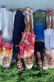 No idea why my picture is upside down. I love this. My legs are short, so I was hoping it wouldn't be too long. It's not at all. If you DO have long legs, take note that it's short! I wasn't sure I'd love the longer sleeves, but I really do. I really like that the back ties at the neck, and you can make it conservative or sexier and open based on how you tie it. Colors are vibrant and fun. Nicely lined on the bottom. - Melanee D.