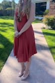 This is my new fave summer wedding guest dress. Its light but feels secure. Is flowy but doesn't expose you every time a gust comes through. The color is beautiful! Before i got the dress i read the reviews and i have to agree with most of them - the dress is essentially TIED onto your body. This makes for a great 'custom' fit (especially for someone like me in the ittybittytitty committee) but i have no idea how i would have gotten into this dress without my partner literally lacing me up. So be aware if you are going to be getting ready solo - you may have some trouble. but other than that i am obsessed with the dress! i got many compliments. - Shiloh G.