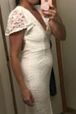 I will be 20 weeks when we have our wedding and when these photos were taken I was 13 weeks pregnant. I did like the dress however and it was feminine. Looks exactly like the model in the photo. The slit is a little high up so if you need to pick the dress up you might have to be careful you don't pull it up any farther and flash people. Otherwise, I was impressed with this dress! - Rachel B.