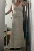 This dress was my second option. I loved the train in the back, the pleat it gave at the bottom like a mermaid dress the front is smooth. The lace details on the collar were gorgeous. It was too modest for me though. The straps were a bit wider on me but the length was PERFECT considering how short I am. - Sherry T.