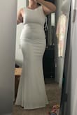 This was such a gorgeous chic mature dress. The back detail was amazing, covered my back fat. Super long, but I'm five feet. In the picture, I'm on a step stool. Remind you, the material is POLYESTER. meaning unless there's a slip underneath, everything will be seen, bra line, spanks & it did run a bit small, I would've gone a bigger size and I did large. Material is stretchy though. Did not keep it because it was polyester and the material was too thin. - Sherry T.