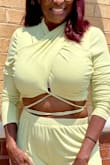 I really like this top but around the neck is a little snug. Ordered XL 36D -Will not go braless!! I wear it more conservative than the model as I'm older, 54 but still want a stylish look. I also purchased the matching pants which fit well. - Jennifer B.