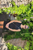 This dress is very versatile as it cinches on the side so it can be worn longer for one look or cinched shorter for a nighttime look dressed up with accessories. Does fit true to size it is a bodycon dress so it does hug but the black color is slimming. It is double layered in the chest area so it does not show any bra lines and is a medium thickness it did get a little hot while wearing in 90° weather. I wore this multiple times during a Europe trip and dressed it up in different ways which I appreciated and it fit true to size. - Jackie M.