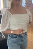 I ordered this to wear for engagement photos! After trying it on I ordered a Small to see if it fits better. The medium fits well but there is some extra material that might make you look bulky in photos. Overall great quality and super cute!! - Kristin W.