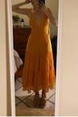 Ended up going with the S I ordered because of my rib cage but wore to a summer wedding and loved it. Comfy and flattering; buttons are annoying but I think they add to the dress - Sophie M.