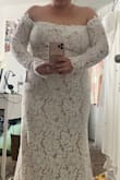 Absolutely LOVED this dress except for the lace at the top was completely different. It was almost a cheap shiny type of lace and the entire dress was different. I would've kept this dress if it wasn't for the different lace. The fit was perfect. It felt amazing on. Sleeve was perfect. I'm five feet so this was obviously too long and I'm standing on a stool in the photo. But the lace at the bottom was just as gorgeous. The details! - Sherry T.