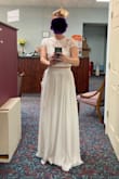 I ordered this for my late-July ceremony. I wanted to dress up but not overdo it. It's very cute. The skirt is very long (as I expected from other reviews) and I took it to an alterations shop. I'm wearing 3.5-inch stilettos in this picture. I am wearing a strapless bra. The top fits over my chest pretty well but I won't be able to lift my arms up without seeing underwire. - Ashley F.