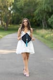Such a beautiful dress. The zipper was very hard to zipper and I had a bit that was unzippered but I loved it! Used it for my graduation photos! - Monica W.