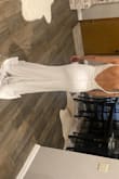 I love The way this dress hugs my hips! I wish It had a slit in the front, but the back of it is exactly what I wanted! It's a little long so I'll need to take it up. - Stacy P.