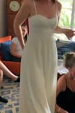 The top bustier part and the bottom dress part are a little different color and different material. Top is more white & a little shiny/smooth, bottom is cream and not shiny. I loved the way it fit, but the color & fabric scheme was not what I was looking for. - Alexa D.