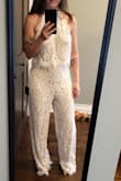 This jumpsuit is pretty cute, though the fit was a little loose I should've sized down. Long in the leg for a shorty like me. Would need to get it altered a little. But a great look for a rehearsal dinner - Shana L.