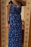 I order this dress in two colors. The small fit differently around the waist area of each dress. I like the blue best and was less snug around my waist. The top fit perfectly, but I added a stick to the front for a more modest look. Worked great for a formal wedding on a warm day. - Lyn E.