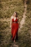 Beautiful dress, great for our family pictures but runs a little big. I would have gotten a smaller size if I could have. I'm 5'7 and was tripping on the bottom of the dress but overall it was beautiful. The filter on my picture makes it look more red, but in reality the color is true to the image on the website - Ariel M.