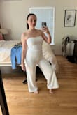 I got this for my wedding rehearsal dinner and it's fabulous! I usually wear a small in Lulus dresses so that's what I originally ordered but returned for the Medium because it was just a little too snug. So I would say it runs a bit small, plus when it's white, the tighter it is, the more see-through it is. That said, I'm wearing it with a nude thong and it doesn't show the panty lines. It's really elegant and flattering! - Sydney D.