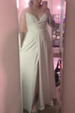 It's a nice dress, but not flattering on smaller busts. I'm 5'6" and the length was pretty long, so it would need to be hemmed. The dress was lined but you could still see the pockets. I ended up returning it. - Jasmine H.
