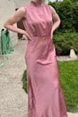 The dress looks exactly like it's advertised! I wore it to a wedding after I had steamed out the wrinkles from the shipment of course, and I got multiple compliments and people asking where I got it from. It was extremely flattering. I would recommend if you do have larger hips or are more on the curvy side that this dress may not be right for you as the area around the hips may be too snug and may distort the dress shape. I will definitely be coming back to this website in the future! I also paid extra for fast shipping and it came on time so I was so pleased! - Jessica B.