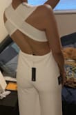 I bought this for my wedding reception. The jumpsuit material was not what I expected for the price, it was slightly see-through/cheap looking. The fit (my measurements 36-28-38) was a tiny bit big but still wearable. The criss-cross back is very beautiful though. I ended up returning the item.
Canadian buyers beware - I returned two jumpsuits and the shipment was about $100, which Lulus does not reimburse you for. Overall, I was very disappointed. - Keepa K.