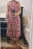 After reading reviews I decided to get a size smaller (S instead of M) and it fits perfectly. I really like the print, it doesn't choke me in the neck area and it sits comfortably in the waist area. - Hadas M.