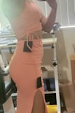 This dress looks just like in the picture. But the fabric does not really stretch, so it fits tight. My belly shows, but i guess that was expected with this type of fabric. Length is ok, a little longer than expected. I cannot return bc it was a final sale. I'll have to work out a little before wearing it. - Teresa M.
