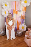I wore this for my 70's themed bridal shower. I got SO many compliments! So comfortable and flattering! Obsessed! - Katie T.
