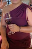 I love the way this dress fits and the color! The fabric is more casual than I anticipated so I would not wear it to a wedding. But I wore it for a casual date at a bar with sneakers. Very soft and comfortable. Love that you can adjust the strings on the side. I ended up cutting the strings a little because they were super long. - Vanessa U.