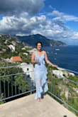 I wore this dress to a wedding on the Amalfi Coast in Italy. It was perfect! I received a ton of complements. The top was a little big but not enough that I needed to get it taylored. There isn't a ton of stretch but it fit me perfectly. I also ordered a size Medium and that was huge on me. I loved it so much I also ordered it in wine for an upcoming fall wedding. 10/10 - Ann M.