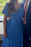 I usually don't like wrap dresses like this, but this one is so beautiful! It is a very vibrant color and has a tie on the inside to keep it securely shut. I did safety pin the chest a bit, but that's because I like to show less cleavage. Very pleasantly surprised by this dress! (Yes, I cropped out my face. Y'all don't need that). - Emily