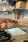 I loved this dress. Really looks good on someone with curves. This dress really wouldn't have required very many alterations for me personally! I returned because it showed off a little more cleavage than I was willing to show on my wedding day ;) - Alix M.