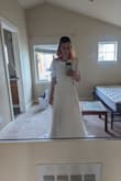 I liked it but I ended up going with my first choice of dresses for my wedding only because it was more my personal style than this one. This dress was elegant and I did love the back opening and the skirt opening. It was also very long on me but with the right shoe it would still work. - Samantha G.