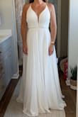 I ordered this dress along with several others for an at-home try-on party with my closest friends & family. We had a charcuterie board, wine, & SO MUCH FUN! Way better than a 60-minute appointment with a limited # of guests - typical of a bridal boutique! I will say that my expectations for online wedding dresses at this price point were fairly low. However, with Lulus' generous return policy I had nothing to lose. Wow!! I'm so glad I took a chance! I was so surprised at the quality! I didn't tell anyone the prices until after I tried on every dress. NO ONE could believe it. These dresses could easily hang in a bridal boutique & you would never know the difference. Seriously! This particular dress fit great & the bottom flowed well. The lace-up back would allow for various bust sizes but the waistband doesn't have any give so base size off that. The length would have been the only alteration needed. I returned it only because I fell in love with another Lulus dress. I can't wait to wear it for my wedding! - Kristi W.