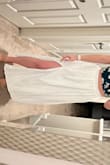 Kinda wish it was a high-low with a slit instead of a straight cut across the bottom. But the coverage is great and it's not see-through - Jessica G.