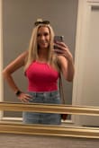 I ordered a large for the length, but it's stretchy and fits well. Cute top with a sexy back. - Kayte F.