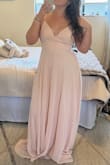 The dress is a beautiful color like the photo. No stretch to the fabric and a zippered back. Love the button detail and lace. Not too heavy of fabric and not see-through. Didn't need a bra. A little long without shoes. - Camille L.