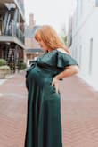 If you are using this for maternity photos, it is perfect, you do need to safety pin the top together because the button just falls open. I love that the straps were adjustable and that this was a true wrap dress. - Elizabeth