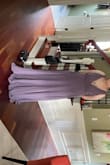Very nice dress. Bought one for both of my daughters for bridesmaids dresses. This one pictured is wearing a large. Nice quality especially for the price. Will need to be hemmed but no biggie. - Candace D.