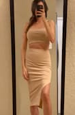 Love this style. You can wear a bra with this! This two-piece is on the tighter side. I couldn't squeeze into the small but the medium fit perfectly snug. - Kristen M.