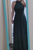 I love it! It fits very well and the fabric is very nice! It's a stretchy sort of satin so it's quite comfortable. The back is beautiful! The only issues are minor. It's too long which is expected for a formal dress. Also the bust has a bit too much fabric which surprised me because I'm well endowed. Nothing a tailor can't fix. Anyways I'm very happy and impressed especially at the price point. Love it!
Also the pictures make it look more blue but it is definitely more emerald. Don't fret. Oh and sorry for the dust on the mirror! - Holly Y.